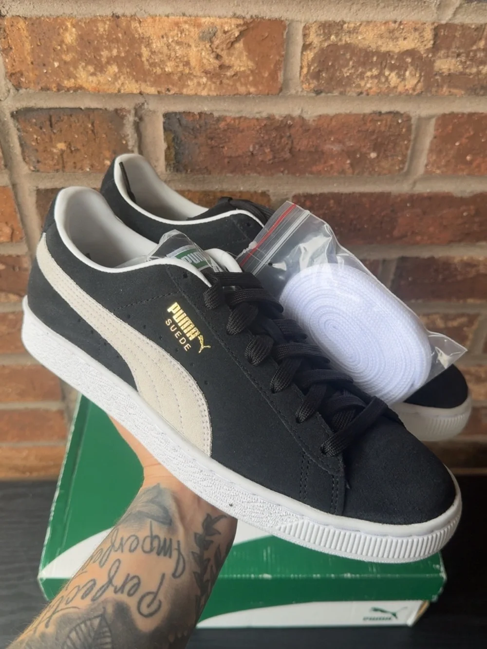 Puma Suede Low-Top Sneakers in Black and White